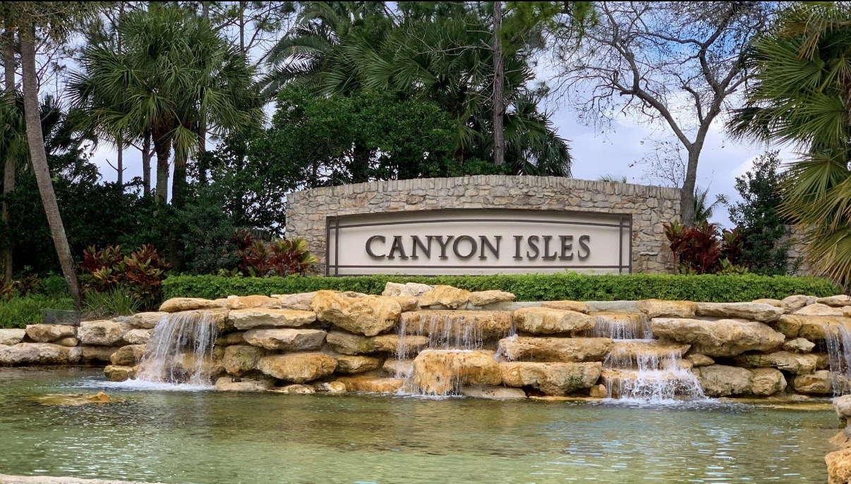 Canyon Isles community entrance with stone waterfall feature in Boynton Beach, Florida