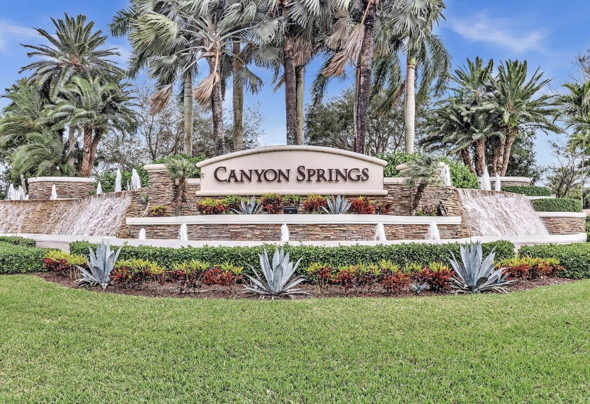 Canyon Springs gated community entrance with palm trees and fountains in Boynton Beach, Florida